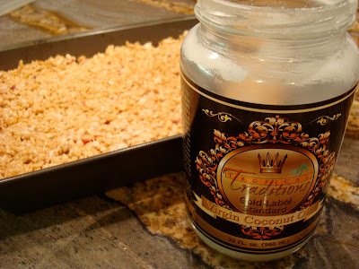 GF Vegan "Rice Krispie" Treats spread in pan with coconut oil jar