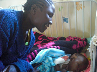 karanda mission hospital zim team smiling mother child young down her
