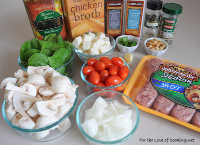 Fettuccine with Italian Sausage, Mushrooms, Tomatoes, Spinach, Pine Nuts, and Basil