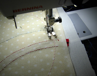 sewing around the circle, just inside of the basting stitches