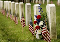 Flags at tombstones at Arlington National Cemetary