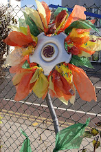 Recycled hubcap flowers by Tina Tigh and Su Breakwell