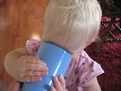 Drinking from a big cup.