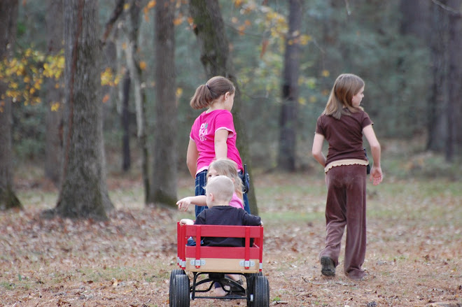 Gabby and Lysse strolling the kiddos around