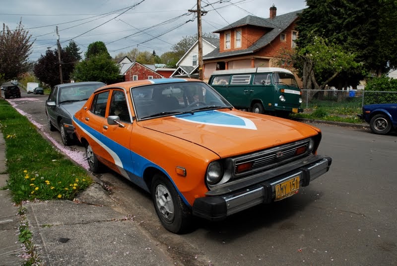 OLD PARKED CARS. 1977 Datsun B210 Sedan.