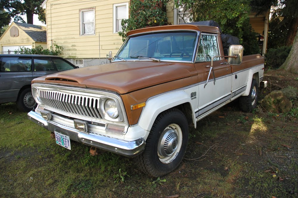 OLD PARKED CARS. 1974 Jeep J20 Pioneer.