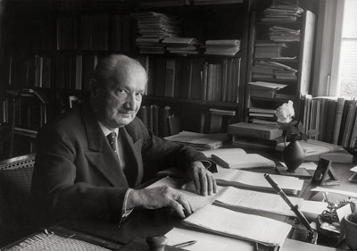 Philosopher Martin Heidegger, sitting at his desk