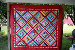 String quilt with lots of Red