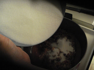 Add sugar mixture to plums