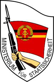 [180px-Emblema_Stasi_svg.png]