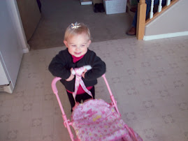 Baby in the buggy.