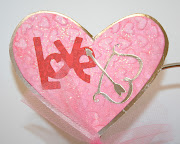 . design card. Using the Bazzill silver foil cardstock, cut the same heart . (love heart)