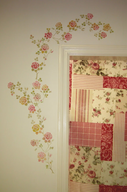 Roses climb a door frame