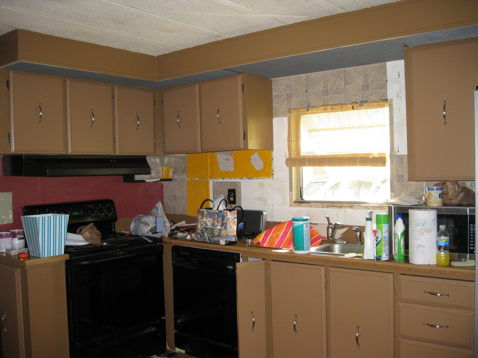 Kitchen wall tile backsplash is another view of the kitchen with a dark red wall. Not my style