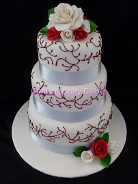 Red piped   vines with sugar roses.