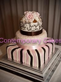 Chocolate candy stripe with piped detailing with sugar roses