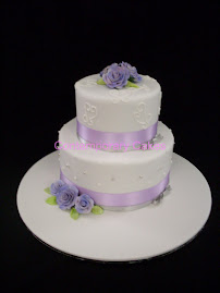 Lilac sugar roses 2 tiered stacked wedding cake.