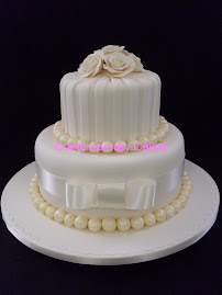 2 tier stacked with sugar roses and stripes.