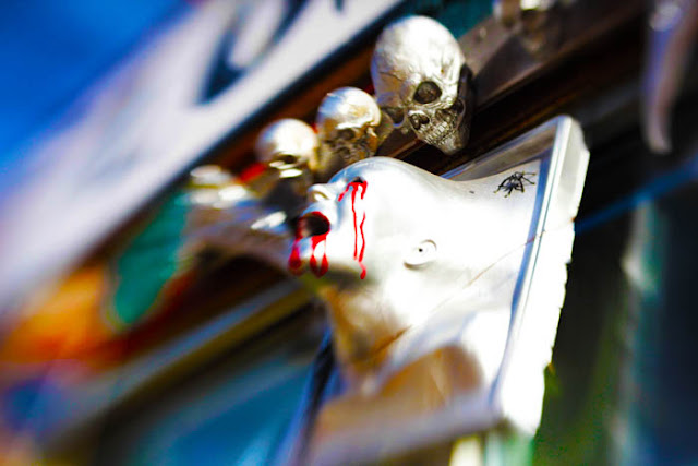 Creepy bleeding eyes on a silver bust hanging outside a costume shop on Broadway in Denver. Shot using the Lensbaby Composer.