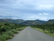 The road leading into the park was dead straight and led into low, . (mountain zebra national park )