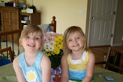 My silly girls and a pot of daisies!
