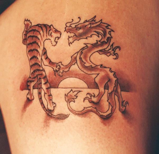 dragon and tiger tattoo. Dragon And Tiger Tattoos