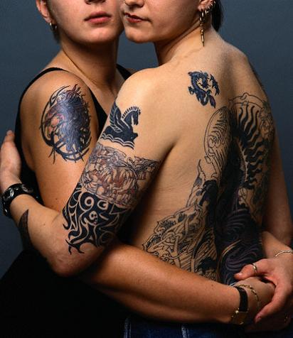 Masculine woman With small black dragon tattoo
