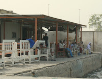 Fisherman relax at a cafe on Doha's Corniche