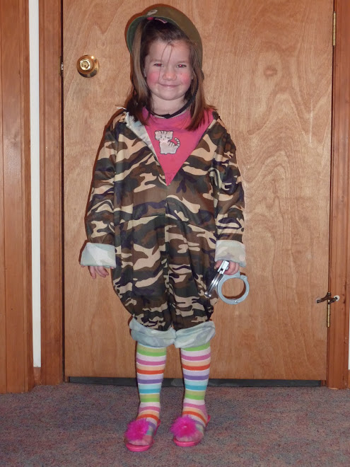 Lacey likes her brothers' cool army stuff