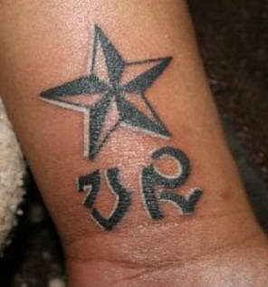 Hand Piercing Tattoo