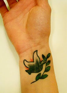 dove tattoo on arm