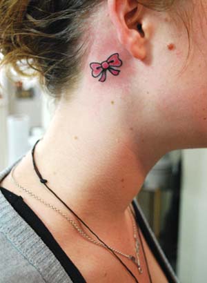 pink bow tattoos Every colored ribbon has different symbols so make sure 