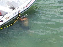 Paul cleaning the dinghy bottom