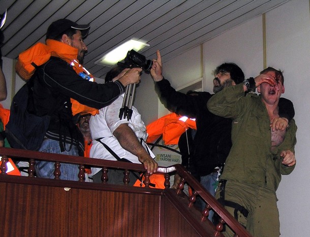injured+Israeli+commando+(R)+reacts+as+he+struggles+with+pro-Palestinian+activists+on+the+Gaza-bound+Turkish+ship+Mavi+Marmara+in+the+international+waters+of+the+Mediterranean+sea+early+May+31,+2010..jpg