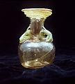 Greenish-brown glass with green coil handles and rim coils 
H. 14.0 cm 
Second or third century AD 
Karanis (UM excavations 