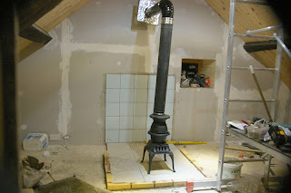 attic concrete base woodstove tile brick edge