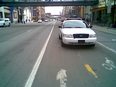 cop parked in bike lane