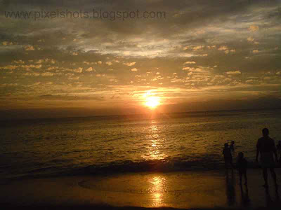 beach golden sunset with clouds in horizon from kerala
