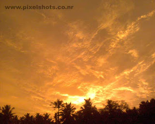 sunset afterglow with cloudy horison,a golden sunset scenery from kerala