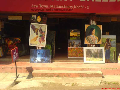 paintings selling shop in mattancherry town of kerala cochin,photograph of oil and ordinary paintings in display infront of shop