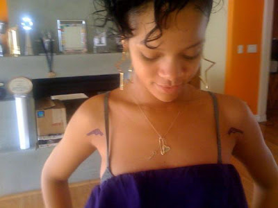 So Rihanna experimented at first, and had the tattoo artist draw two guns on