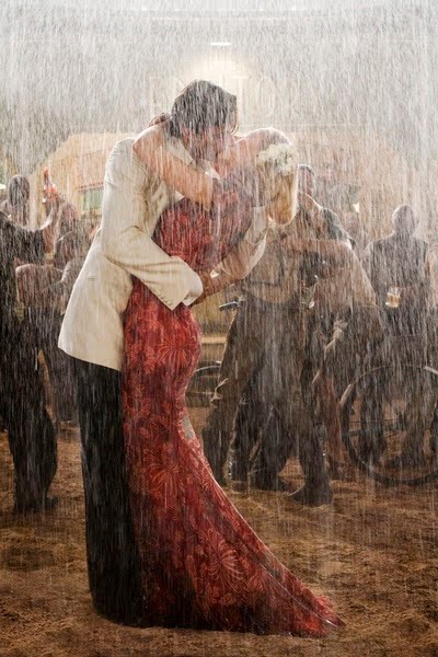 romantic couple kissing in the rain. romantic couple kissing in the