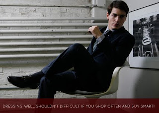 man in suit posing in chair