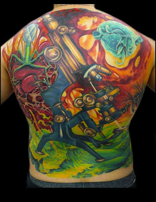 This tattoo is of a microscope. Most of the images are copies of SEMs, the background figures include, a fish parasite, anthrax, a scoop of iced cream that has fallen off the cone, flea eggs, bone marrow, and a virus attacking a sun dried tomato!