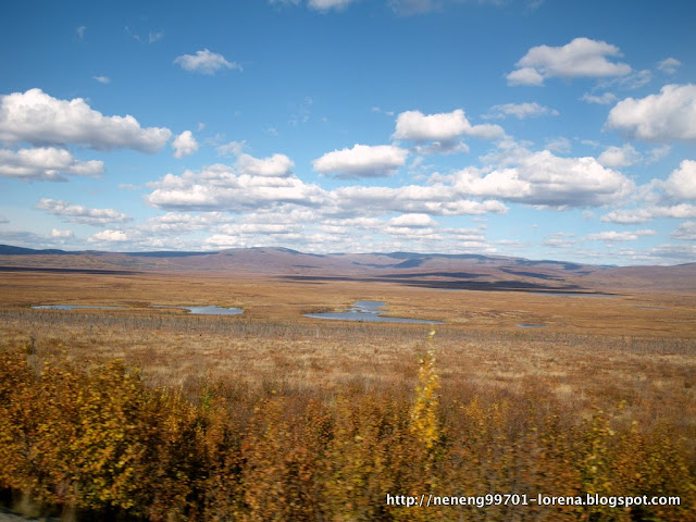 mini lakes, puppy clouds, shadows, scenery from the road to Arctic Circle