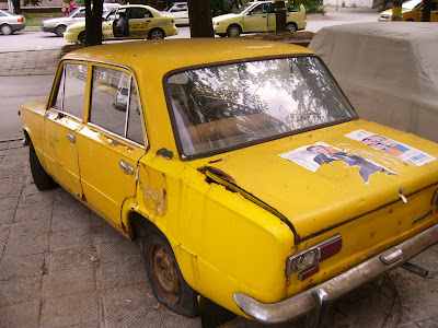 An Old Yellow Lada Taxi In Yambol City Centre