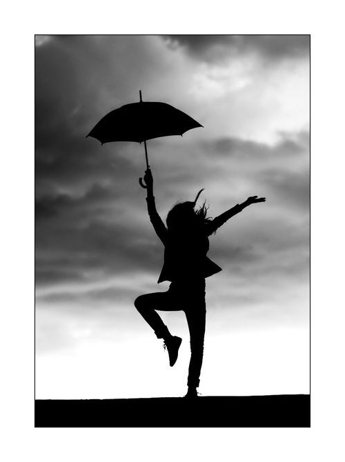 silhouette-of-woman-dancing-in-the-rain.