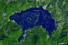 A large bloom of cyanobacteria spread across Guatemala’s Lake Atitlán in green filaments, visible in this simulated-natural-color image from ASTER data taken Nov. 22, 2009 A large bloom of cyanobacteria spread across Guatemala’s Lake Atitlán in green filaments, visible in this simulated-natural-color image from ASTER data taken Nov. 22, 2009