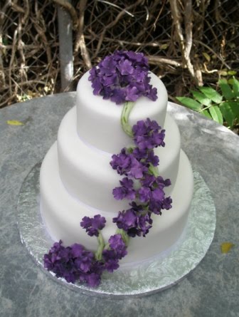 white wedding cakes with fresh flowers