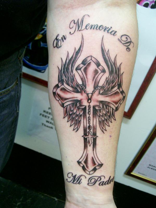 cross tattoos with wings on arm. cross tattoos with wings on